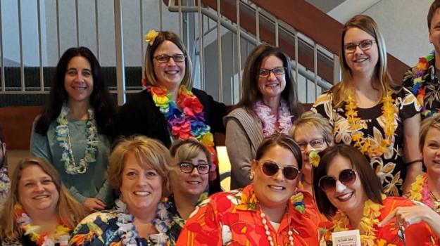 Bank employees enjoy their United Way campaign in Hawaiian shirts and leis