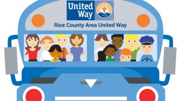 Cheerful illustration of the front of a blue bus with Rice County Area United Way's logo in the "destination" area. People of diverse appearance are seen through the windshield.